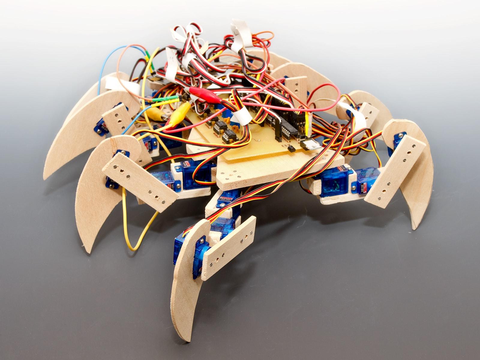 An eight-legged scorpion-like robot with exposed circuits.