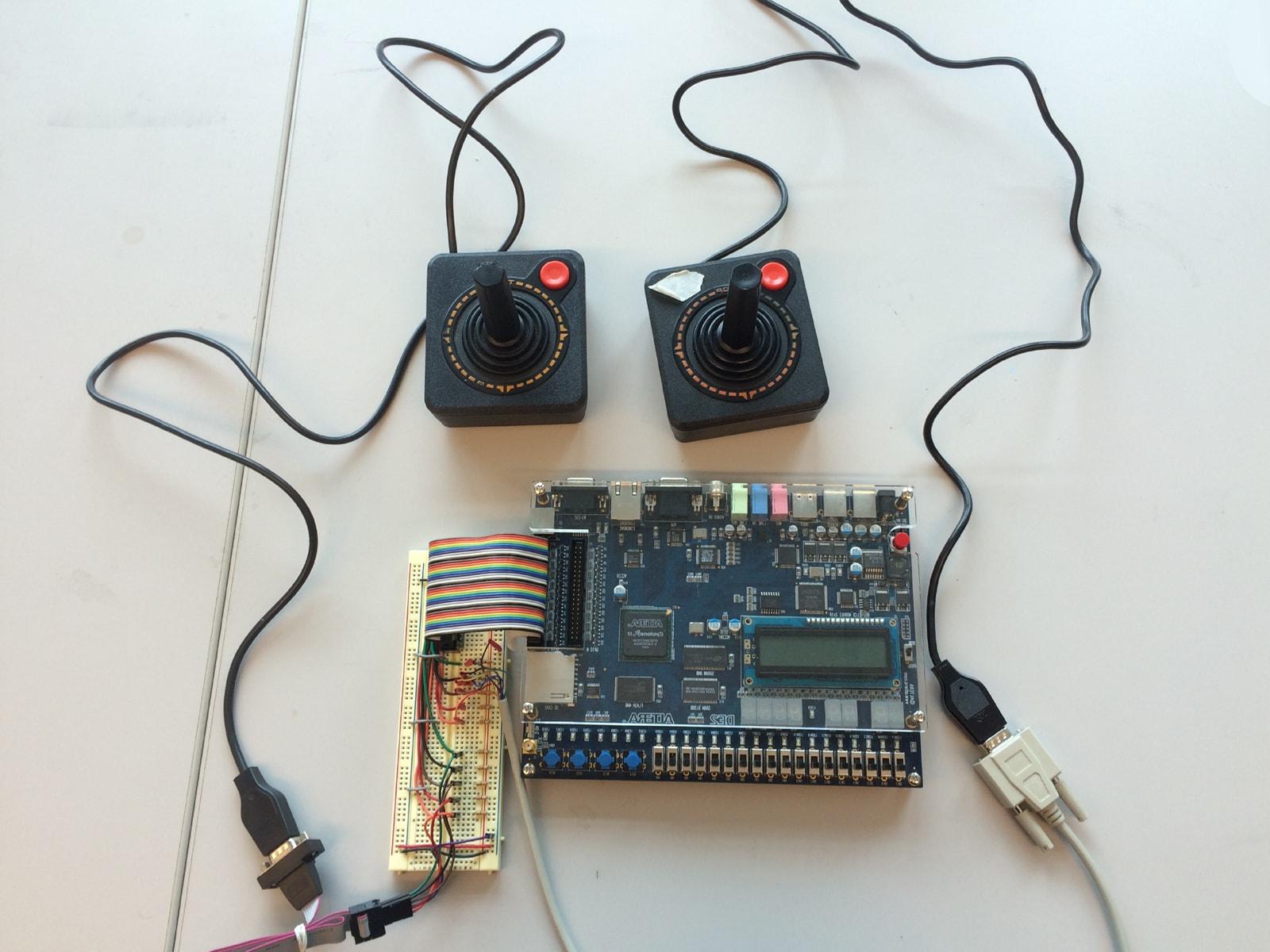 Two Atari joysticks connected to an Altera DE2 board.